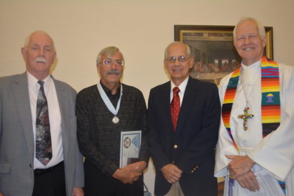 Stewart Henderson (left) and Denny Lowe (second from left) were awarded the God and Service Award on Sunday, April 23 at the Presbyterian Church in Coshocton. Also pictured are Jim Gill and Pastor Jon Carlisle. 