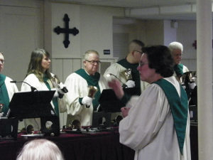 Leslie Dawson directs the hand bell choir from Grace UMC at the Ring the Bells for Habitat Concert Sunday, April 9 at the Presbyterian Church. Jen Jones | Beacon