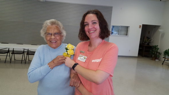 50-year Coshocton BPW member Eva June Kiser is presented a corsage by President Carla Fowler. 