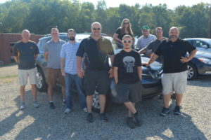 Staff members at Joe Brush Auto Sales gathered together for a photo by one of the vehicles available at the dealership located on County Road 621. 