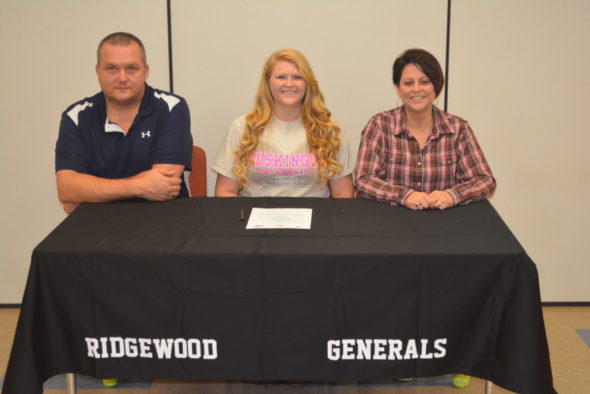 Josey Lillibridge, center, signed her letter of intent to throw shot and disc at Muskingum University on March 31 at Ridgewood High School. At her left is her stepfather Ed Huff and at her right is her mom Michelle Huff. Lillibridge is a senior at Ridgewood.