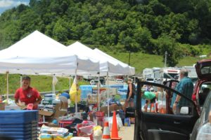 Larene Debnar-Hall, her son, grandson and French foreign exchange student took a vehicle full of supplies to a relief center in West Virginia where they pitched in and helped hand out supplies to flood victims. Contributed | Beacon