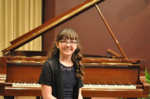 Julia Grimmett won the junior division of the Edward E. Montgomery Jr. Piano Competition held Sunday evening, April 2 at the Triple Locks Theater in Roscoe Village.  Mark Fortune | Beacon