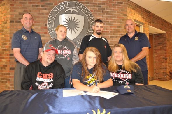 Signing a letter of intent is: Kelsey Crown (center) seated beside her are her father Justin (left) and mother Heather Lauvray. Standing are Kent State Tuscarawas Athletic Director Rob Brindley, Nikki Crown (Kelsey’s stepmother), Wayne Lauvray (Kelsey’s stepfather), and Kent State Tuscarawas Softball Coach Chuck Peach. Contributed | Beacon