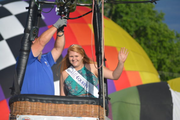 Josey Lillibridge, the 2017 Coshocton Hot Air Balloon Festival Queen, waves as she prepares to take a tethered balloon ride on June 8. The tethered rides were part of the fun at the festival, which was held June 8-10 at the Coshocton County Fairgrounds. Josie Sellers | Beacon