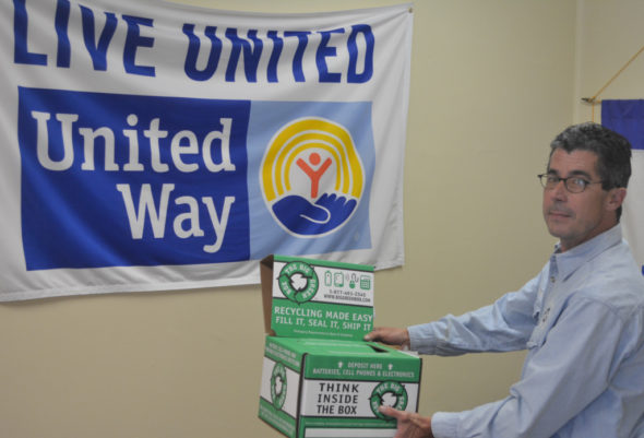 Jeff Wherley from the Coshocton County Recycling & Litter Prevention Office is pictured holding the box at the United Way Office of Coshocton County where disposable batteries and cell phones can be placed for recycling. The United Way location is just one of several recycling locations in the county for these items. Josie Sellers | Beacon