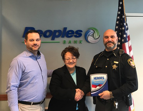 Pictured from left are Phil Hunt (Peoples Bank), Dee Stocker (Peoples Bank) and Lt. Dean Hettinger (Hometown Heroes Award winner). Contributed | Beacon