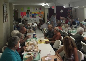 Community members congregate at Isleta United Methodist Church to enjoy the church’s annual ice cream social on Saturday, July 9. Andrew Everhart | Beacon