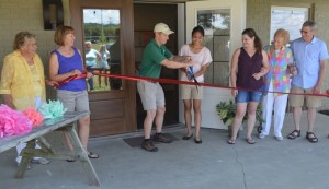 Ryan and Camille McPeek along with family members cut the ribbon to officially open the new M Event Centre at their Colonial Campground & RV Park. The ribbon cutting took place at an open house for the community on July 10. Josie Sellers | Beacon